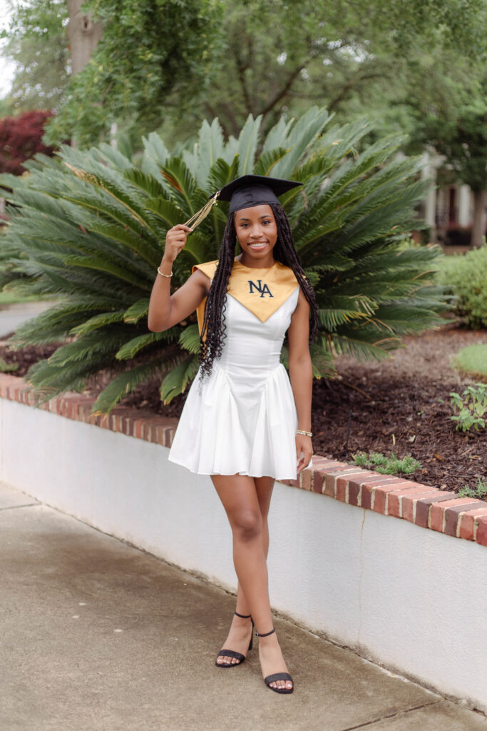 North Augusta High School senior posing for photo session while holding tassel