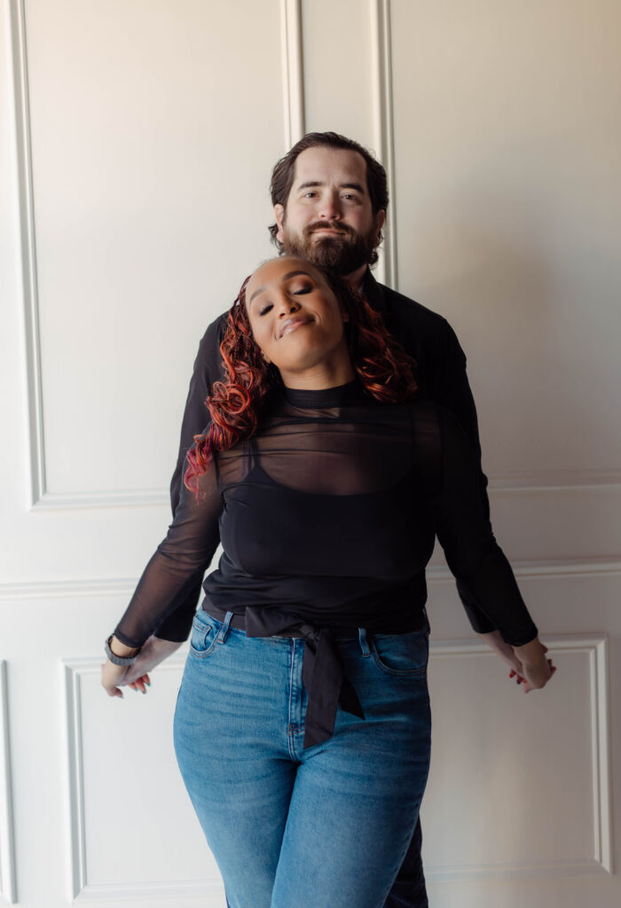 Engaged couple poses lovingly during their studio engagement session in Augusta, Georgia
