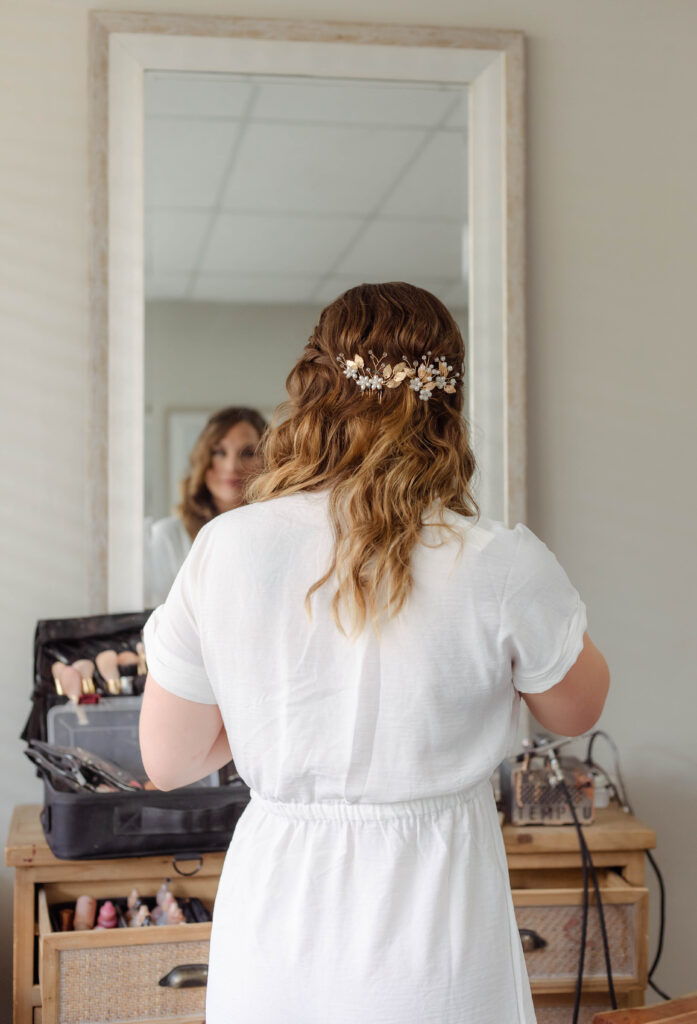 Bride looking in the mirror showing her wedding hairstyle in North Augusta, South Carolina