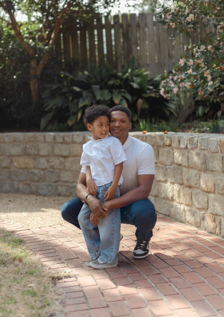 Dad and son posing together for photo session in Augusta, Georgia