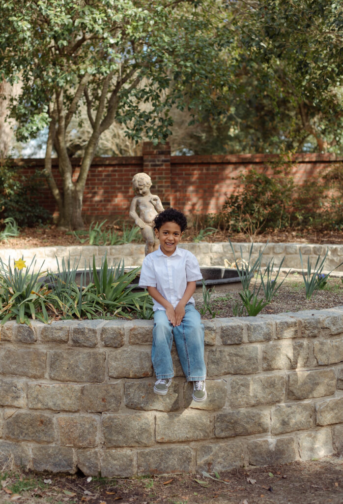 Little boy sitting for photo session at Pendleton King Park in Augusta, Georgia
