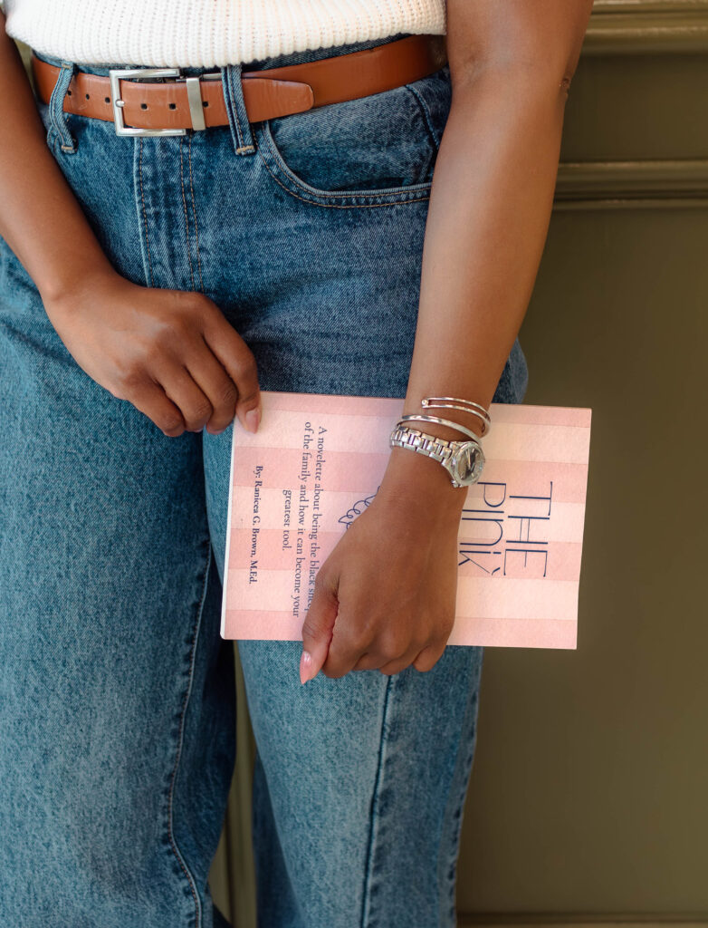 Close-up of author holding her book