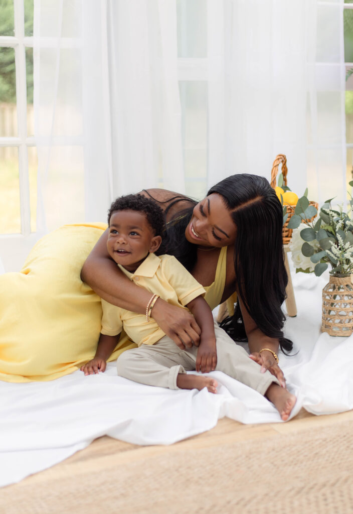 Mother hugs her son close with smiles