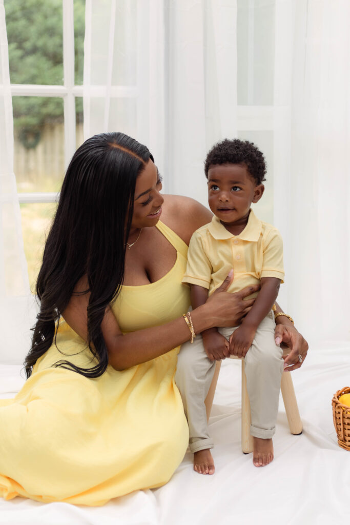Mother smiles while looking at her son
