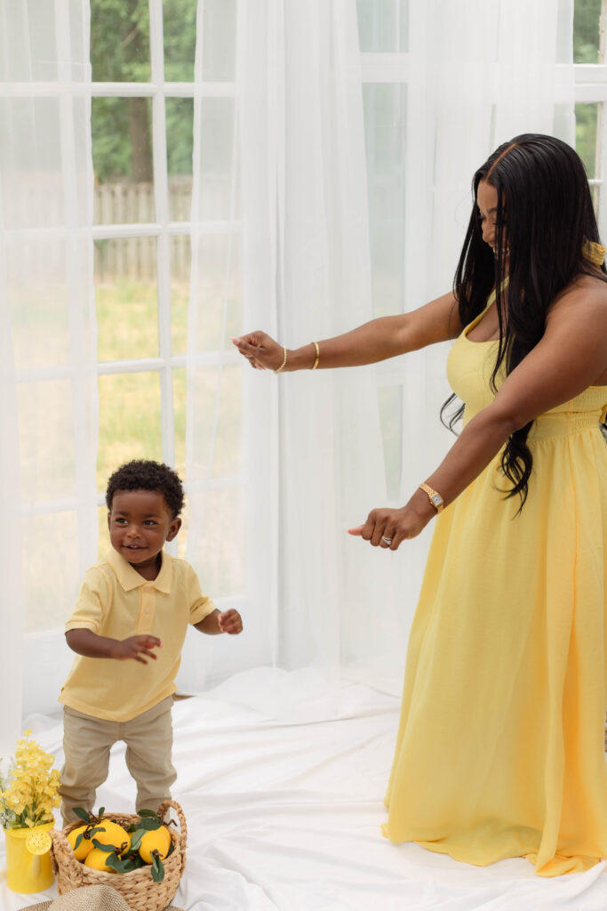 Baby boy dances with his mom for Mother's Day photo session