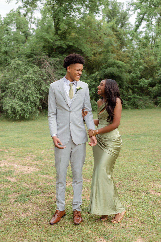 Couple laughing together for prom photos