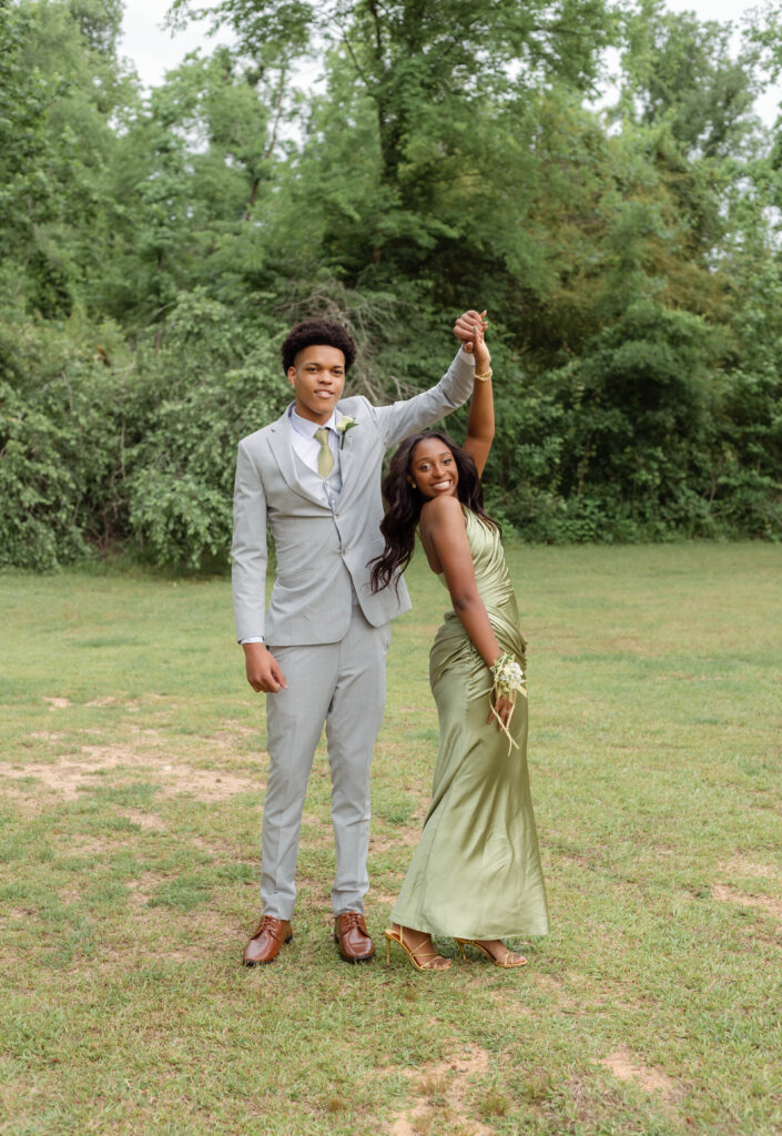 Prom couple dancing with smiles for photo session