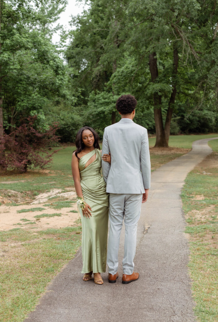 Couple posing together for prom photos