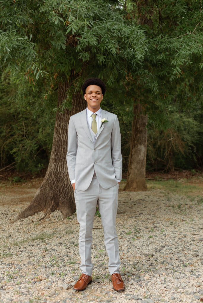 Young man smiling for prom photos