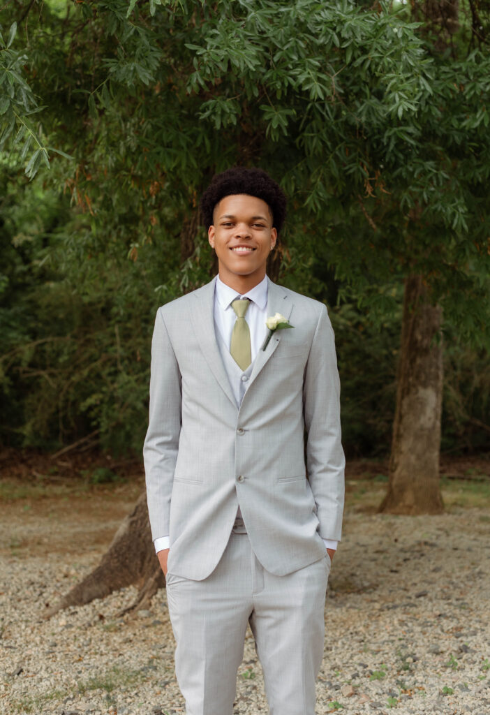 Young man smiling for prom photos in Evans, Georgia