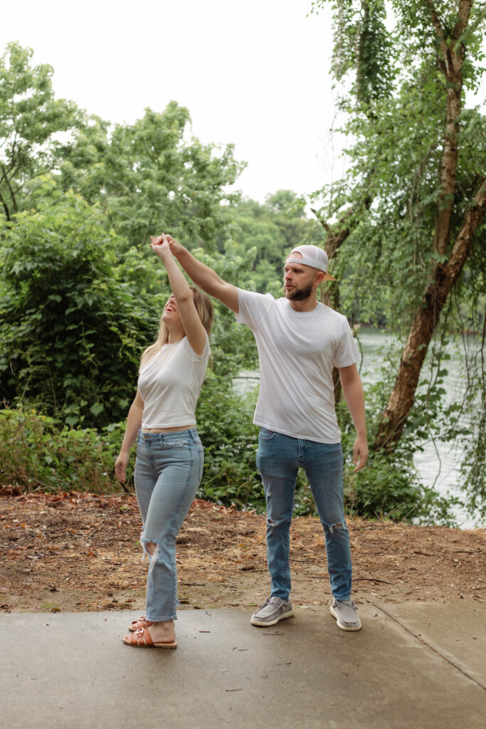 Man spins his fiancée in a dance