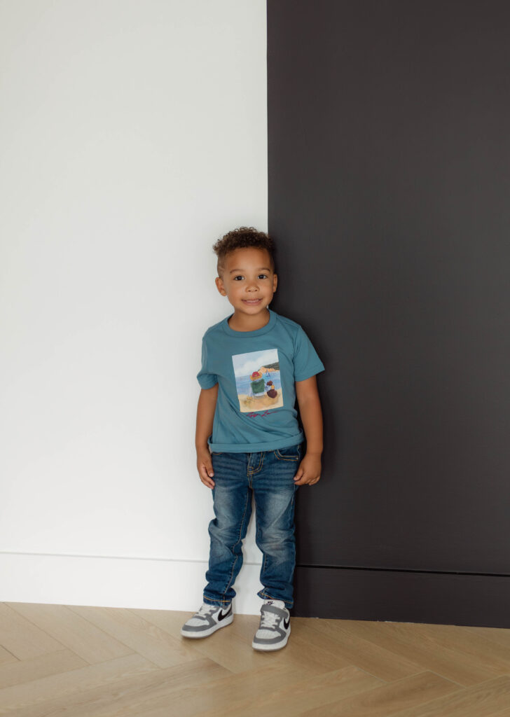 Little kid posing for photos at a studio