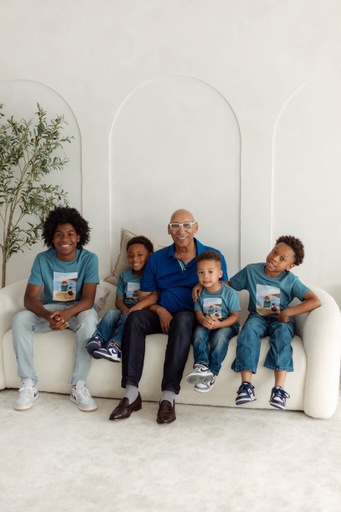 Grandparent smiling with his grandchildren