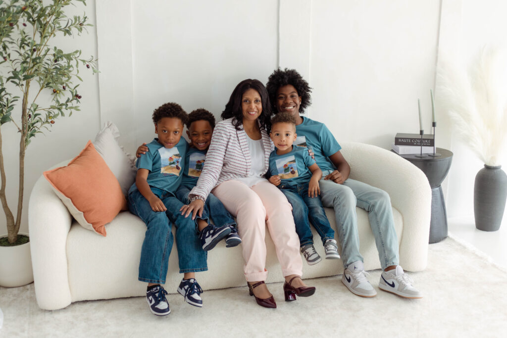 Group portrait of extended family in a natural light studio.