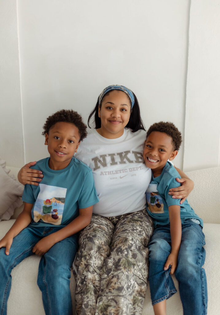 Mom hugs her two sons for photo session at The Muse Room