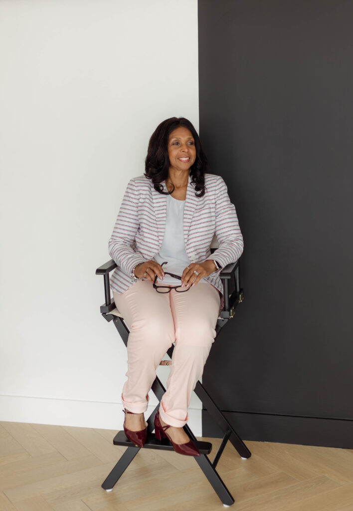Women poses for a photo in a chair