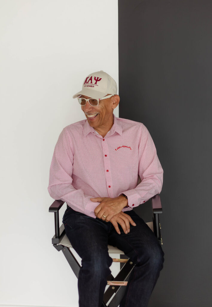 Older man smiling candidly for photos