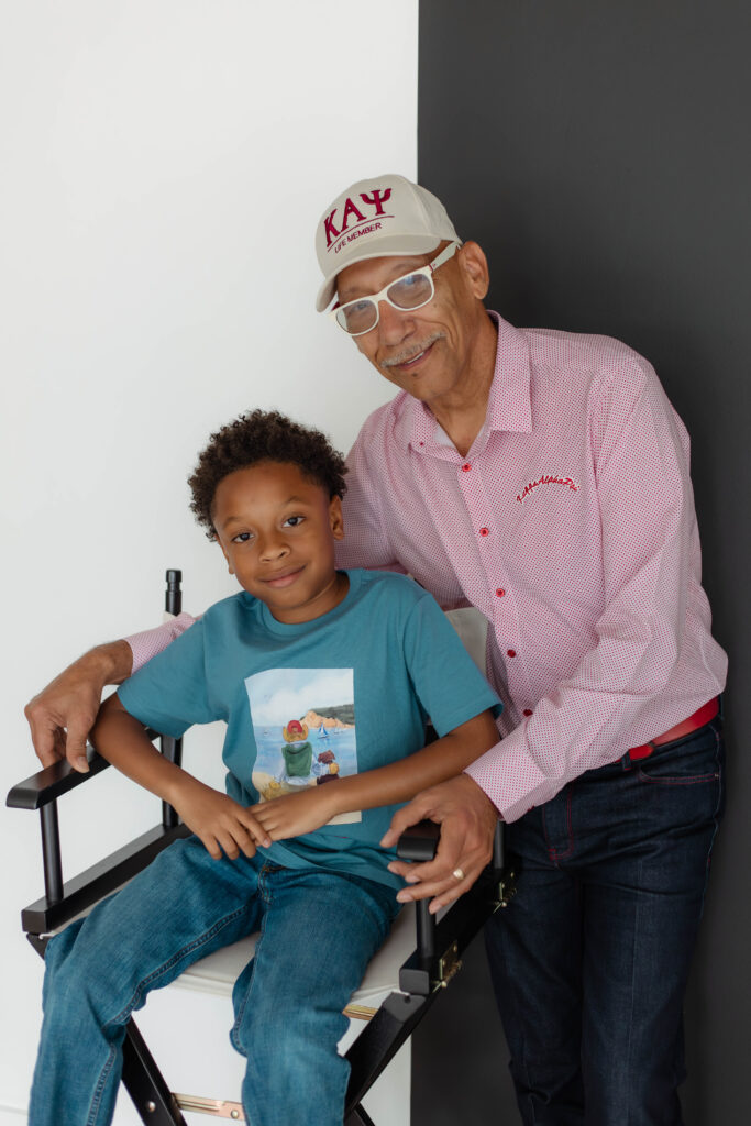 Grandparent posing with his grandkid