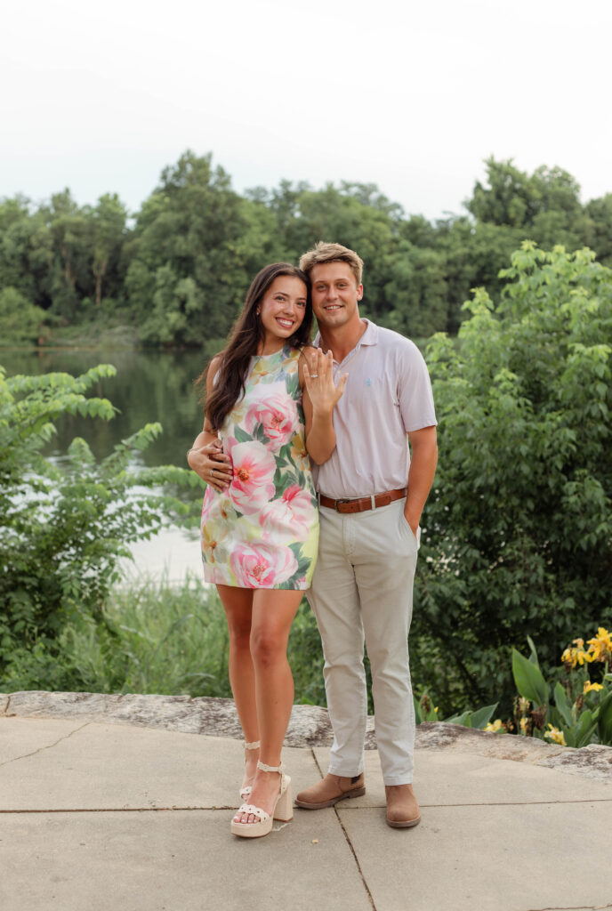 An engaged couple smiling for a photo session