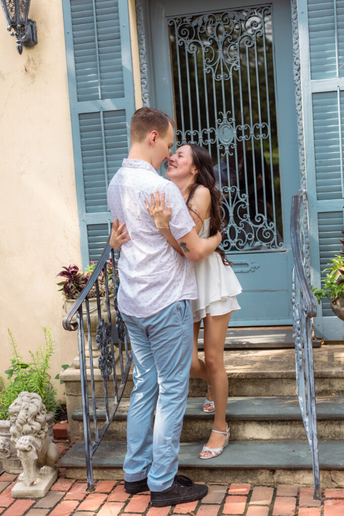 Couple touching noses on European inspired steps