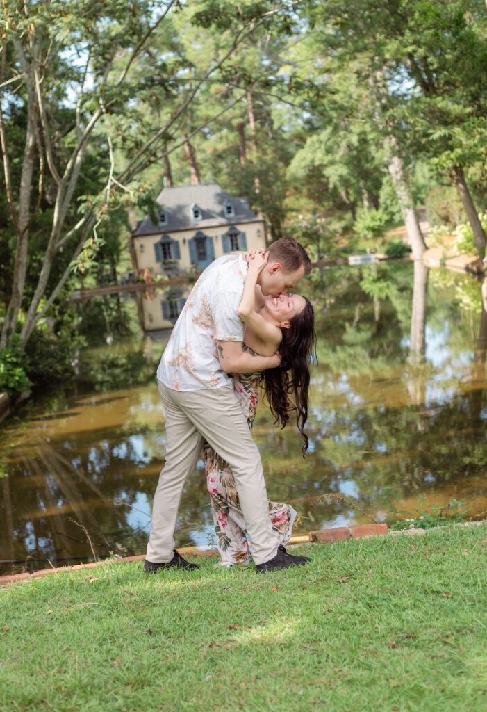 Couple kissing and laughing at Bath Gardens