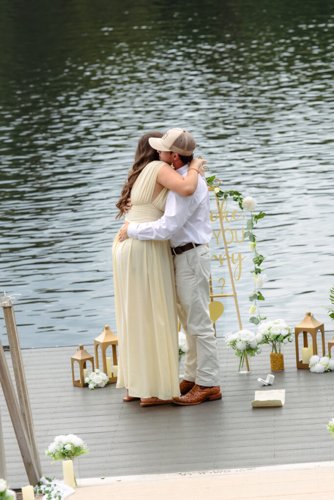 Engaged couple hugging after proposal