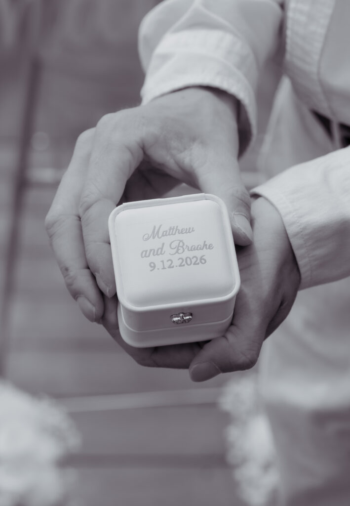 Black and white photo of engraved ring box