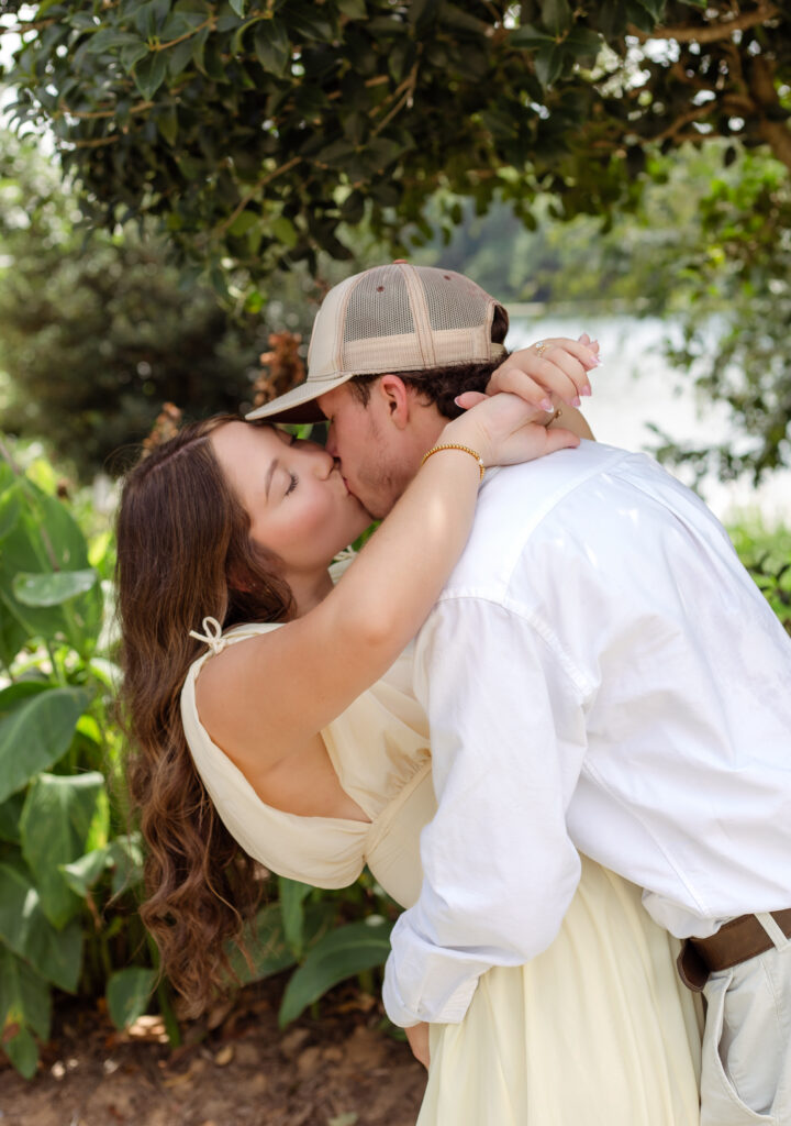 Newly engaged couple shares a kiss