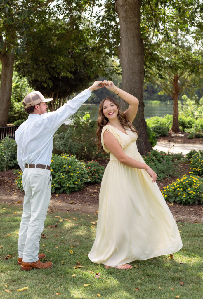 Man spins his fiancée around in a dance