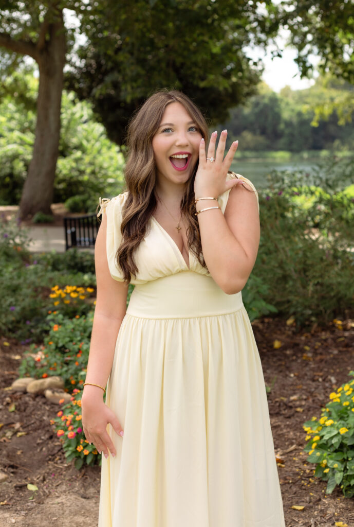 Woman excitedly shows off her ring after being proposed to